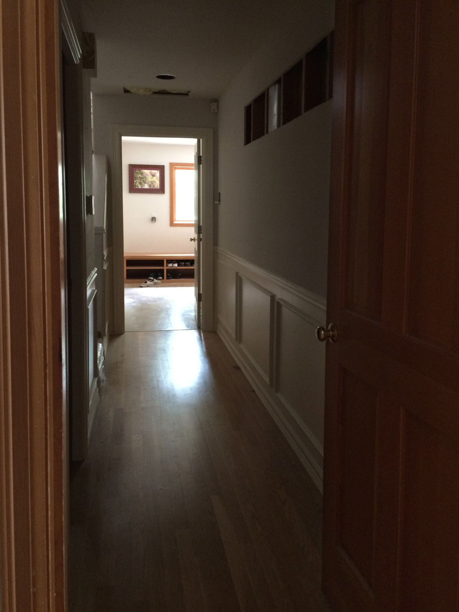 Ran from kitchen to mud room; door the kitchen end hid the hall lightswitch, and why was a door even there?