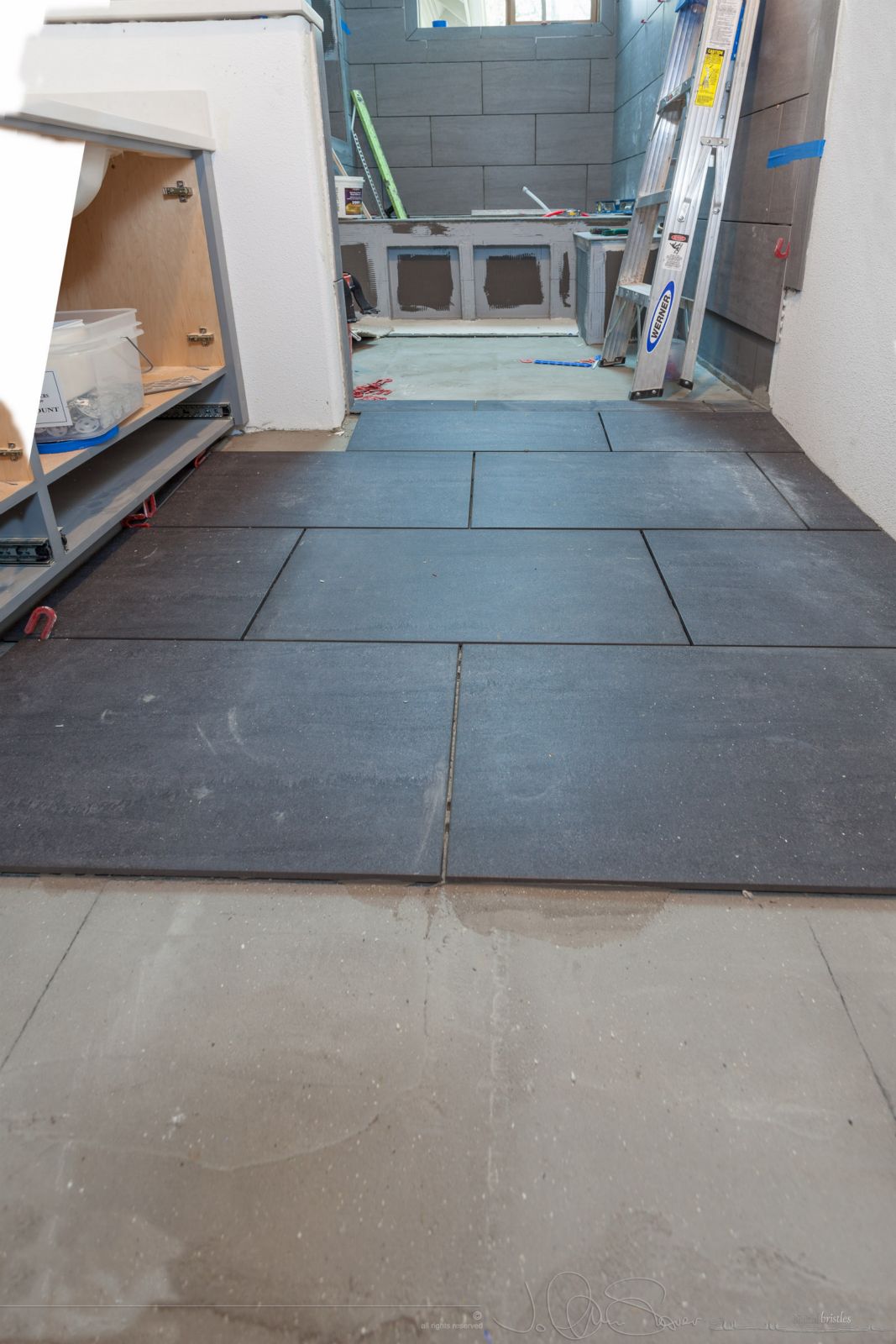 Partial floor installation to allow glass wall/door to be templated. April 13th