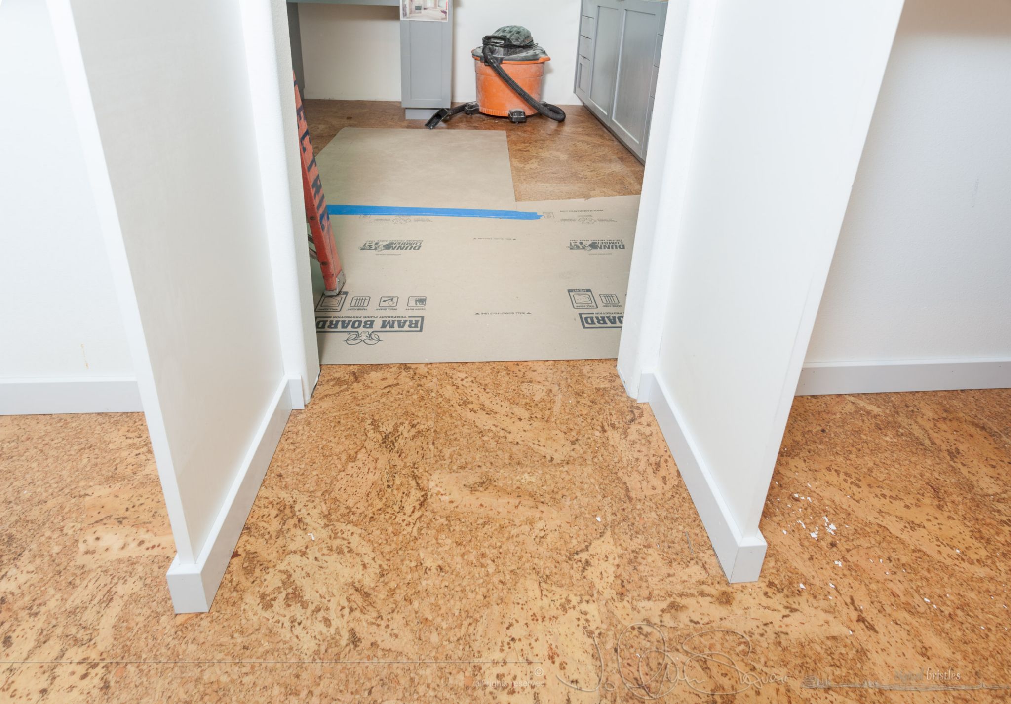 Master bathroom closet gets baseboard that also supports bulkheads
