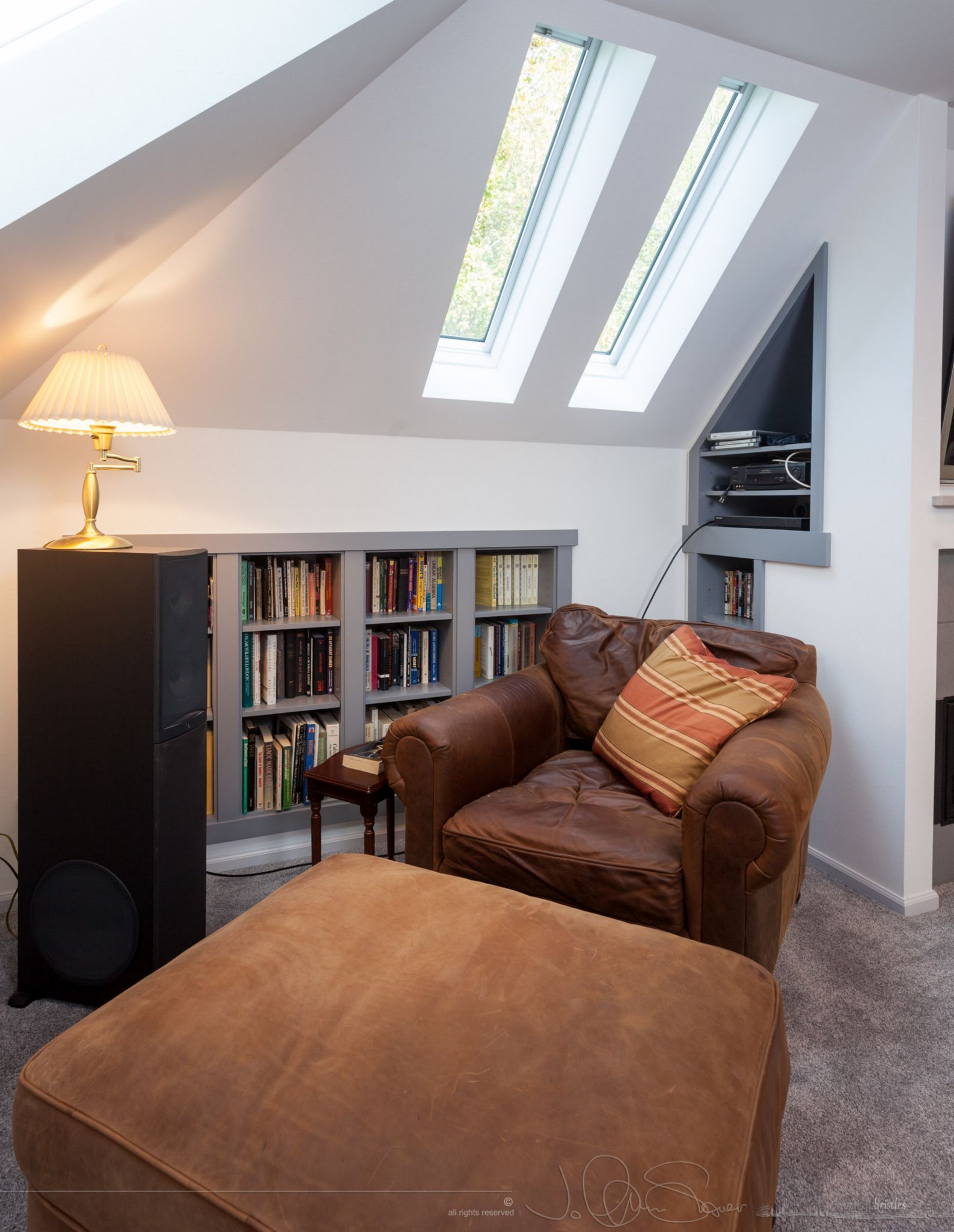 Under the skylights, a comfy chair and some good books