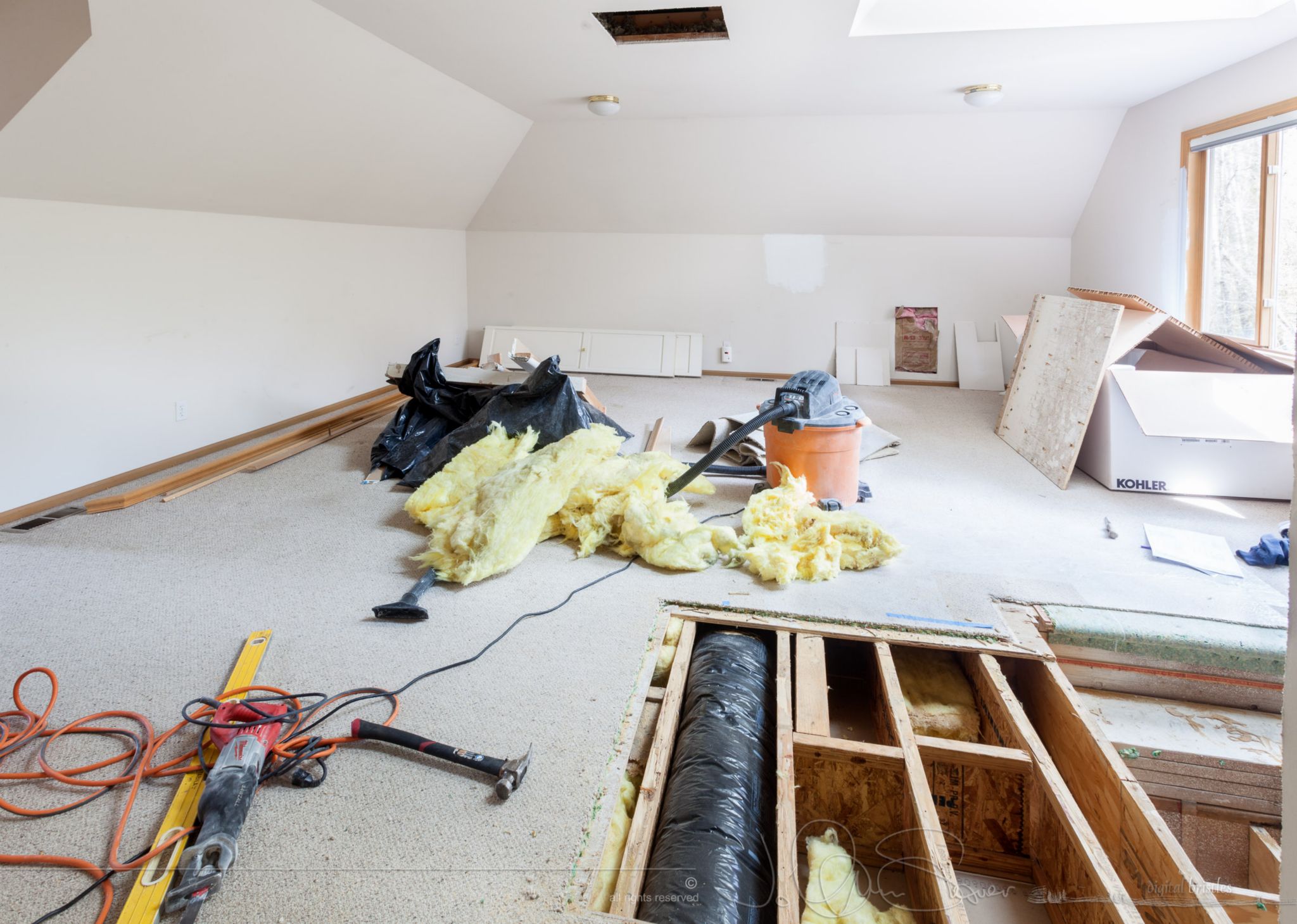 A heating duct.  It can serve the other side of the room as a fireplace is going where it leads