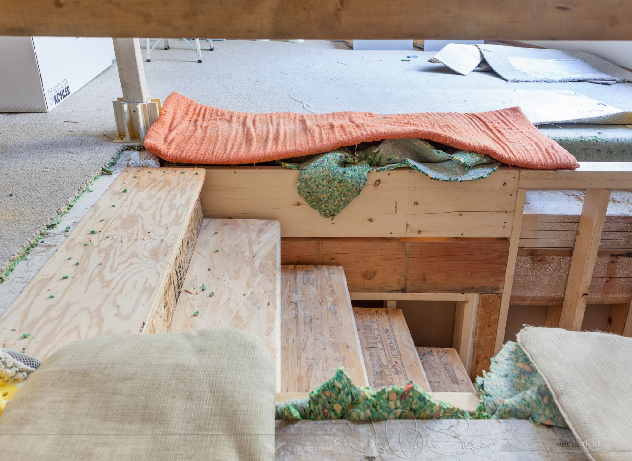 I stuffed some carpet padding into the joists and laid a beach mat, som custions and two car sponges into the various holes...