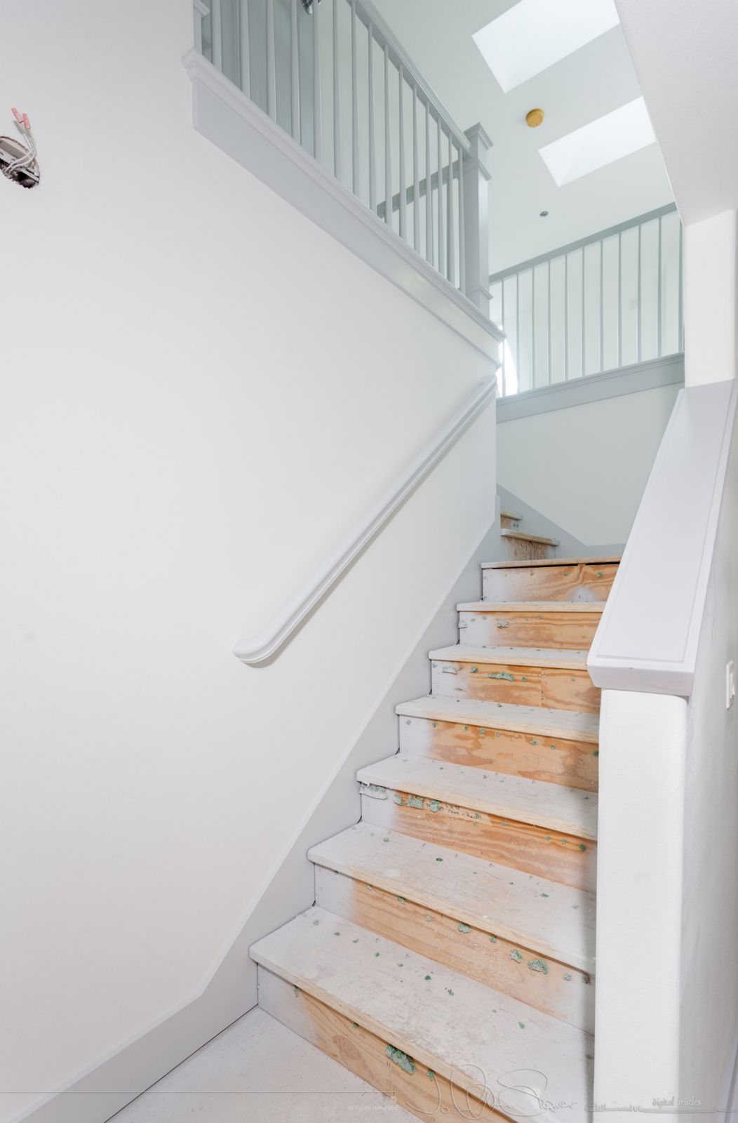 Looking up from hallway to bonus room