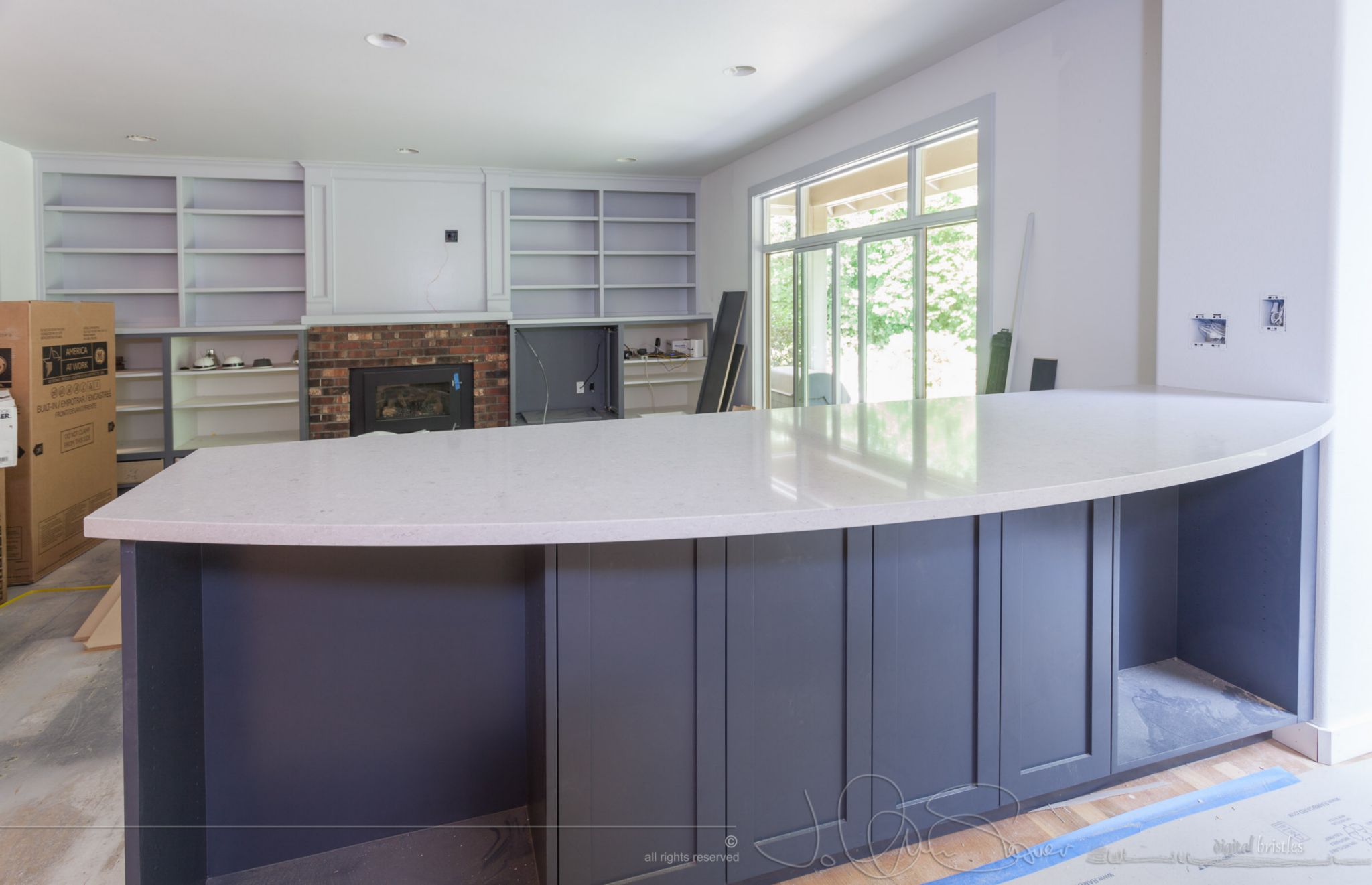 Counter height bar between kitchen and family room