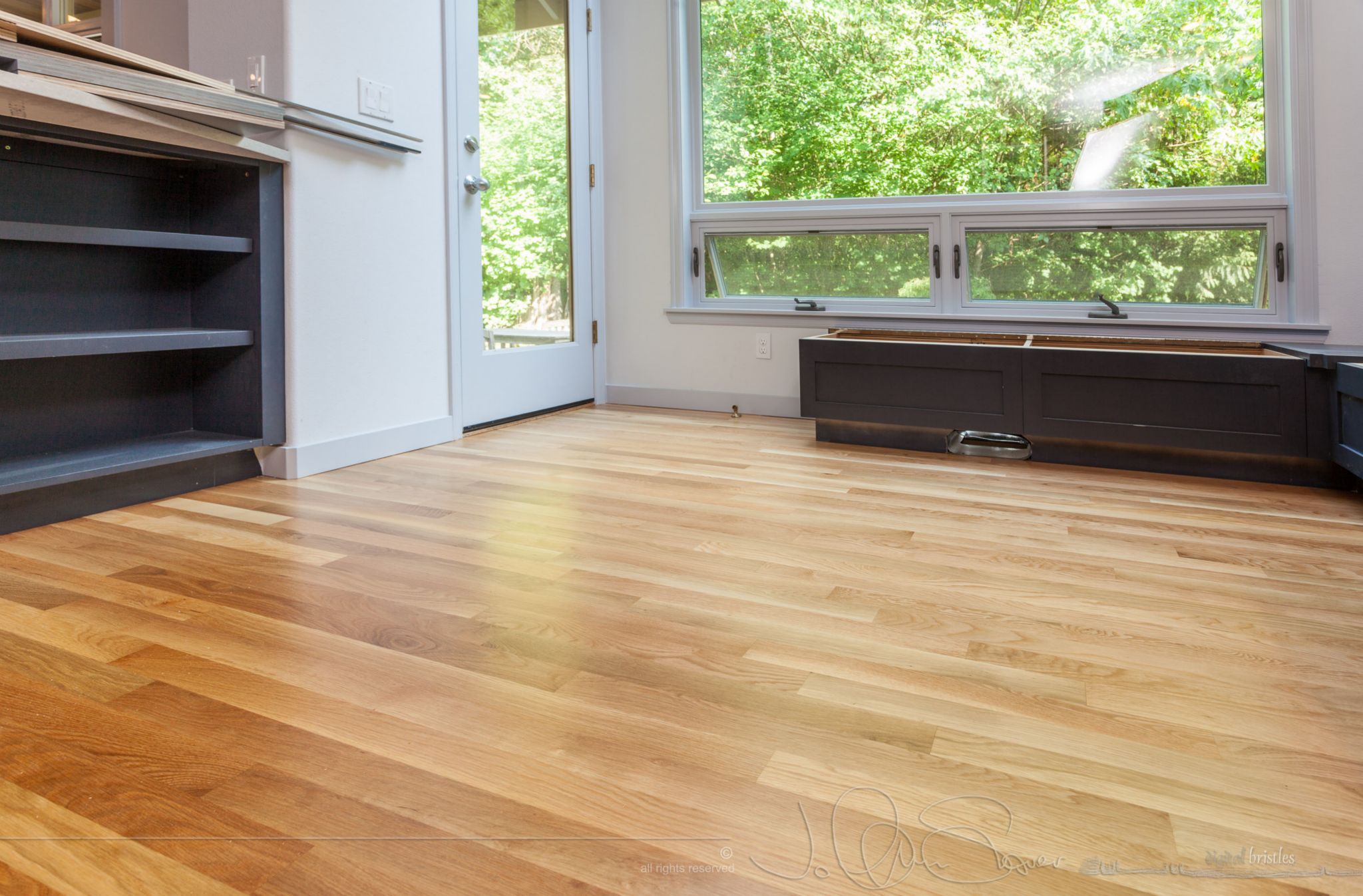 Final coat on the hardwood floors - a lovely satin finish