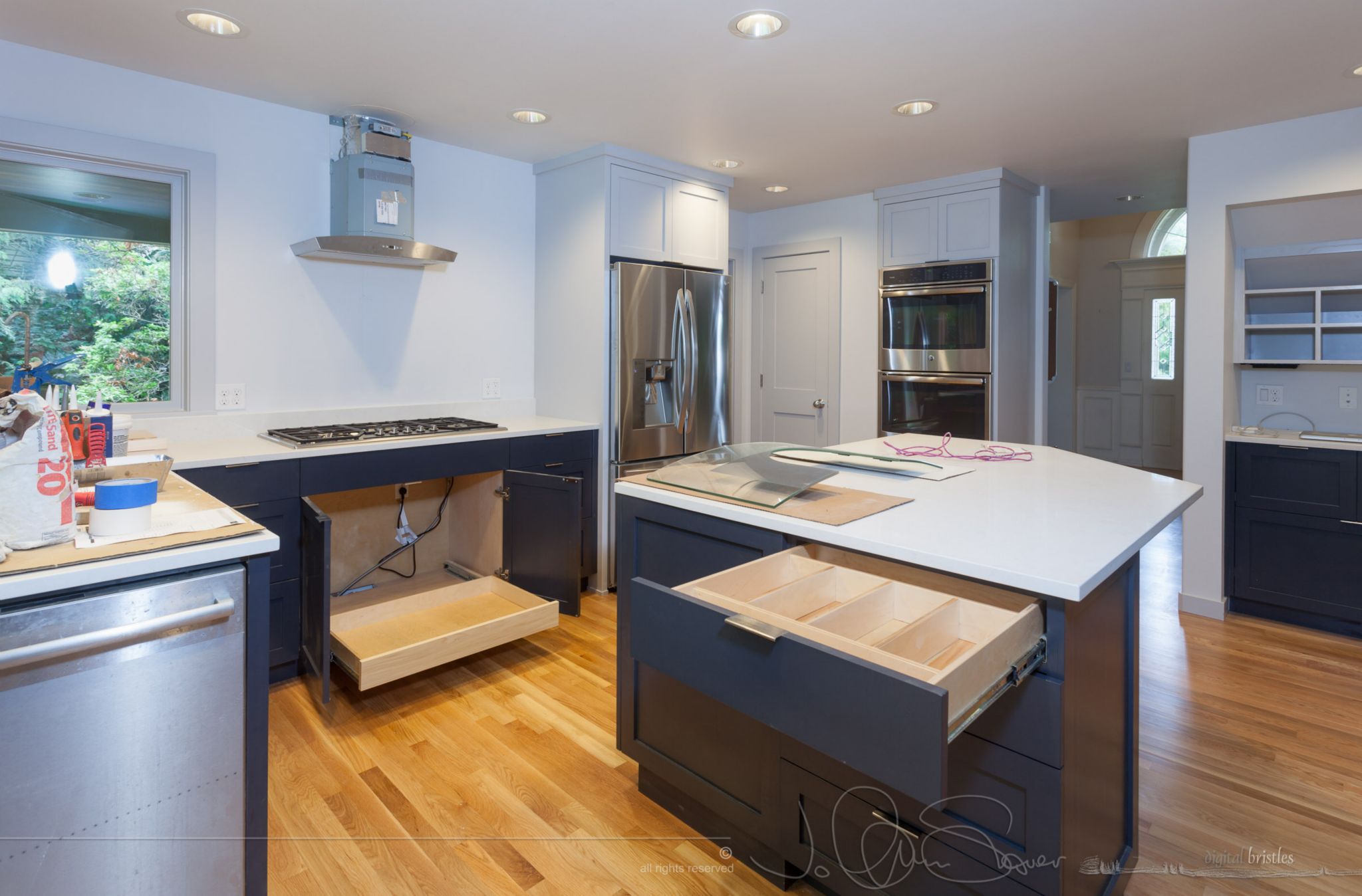 Under cooktop pullout and silverware drawer installed