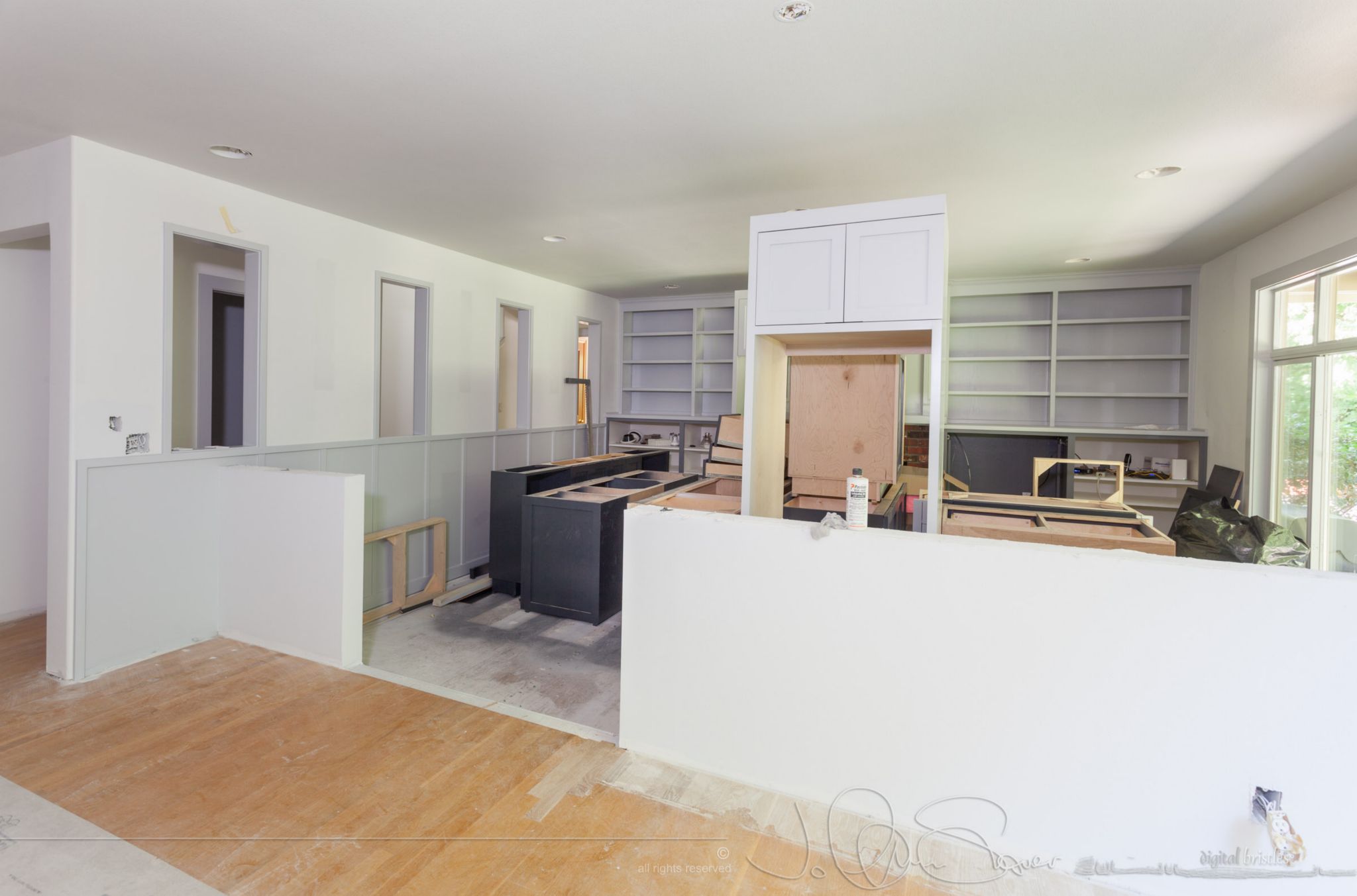 Kitchen cabinets get dumped in family room. June 29th