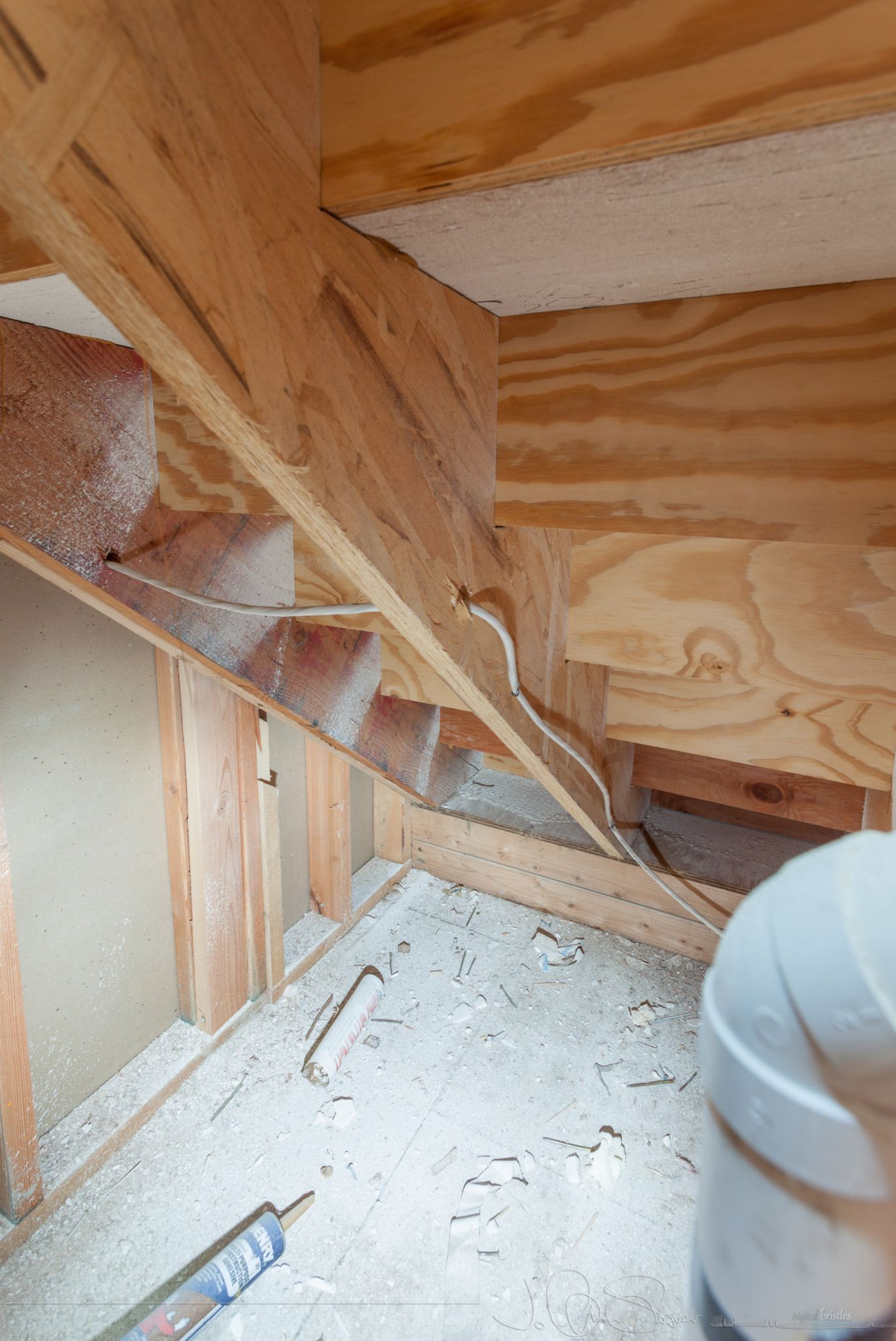 Drywall cut away to show area under the back stairs. April 6th